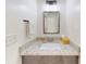 Bathroom with granite vanity top and modern light fixtures at 52900 E 88Th Ave, Strasburg, CO 80136