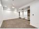 Well-lit bedroom with recessed lighting and lots of closet storage with neutral color scheme and soft carpet at 52900 E 88Th Ave, Strasburg, CO 80136