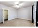 Cozy bedroom featuring plush carpeting, natural light, a fan and closet at 52900 E 88Th Ave, Strasburg, CO 80136