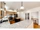 Contemporary kitchen with granite countertops, stainless appliances, a center island and ample cabinet space at 52900 E 88Th Ave, Strasburg, CO 80136