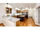 Well-lit kitchen featuring stainless steel appliances, wood cabinets, and granite countertops at 52900 E 88Th Ave, Strasburg, CO 80136