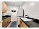 Well-organized laundry room with washer, dryer, and storage cabinets at 52900 E 88Th Ave, Strasburg, CO 80136