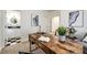 Bright office with a large wooden desk and view into the attached bathroom at 52900 E 88Th Ave, Strasburg, CO 80136