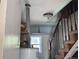 Basement area with stairs, a water heater, and a small window, requiring renovation at 660 Hickory St, Hudson, CO 80642