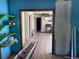 A potential-filled interior showcasing original hardwood floors and unique trim, ready for renovation at 660 Hickory St, Hudson, CO 80642