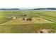 Expansive property with lush green fields and a well-maintained home at 11784 Spruce Mountain Rd, Larkspur, CO 80118