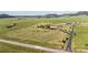 Sprawling property featuring a well-manicured lawn and multiple outbuildings at 11784 Spruce Mountain Rd, Larkspur, CO 80118