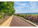 Beautiful backyard featuring a bocce ball court, landscaping, and mountain views at 11784 Spruce Mountain Rd, Larkspur, CO 80118