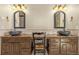 Bathroom with and vessel sinks, granite counters, and dark wood cabinetry at 11784 Spruce Mountain Rd, Larkspur, CO 80118