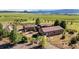 Charming home with lush landscaping, stone accents, and a welcoming entrance at 11784 Spruce Mountain Rd, Larkspur, CO 80118