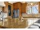 Kitchen island featuring granite countertops, stainless steel appliances, and wood cabinetry at 11784 Spruce Mountain Rd, Larkspur, CO 80118