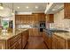 Gourmet kitchen with custom cabinetry, granite countertops, and high-end appliances at 11784 Spruce Mountain Rd, Larkspur, CO 80118