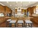 Spacious kitchen island with bar seating, custom cabinetry, and high-end appliances at 11784 Spruce Mountain Rd, Larkspur, CO 80118