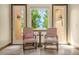 Inviting sitting area with comfortable chairs, accent table, and serene views at 11784 Spruce Mountain Rd, Larkspur, CO 80118