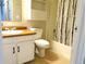 The bathroom features a vanity, toilet, tub, and shower, providing a clean and functional space at 17331 E Mansfield Ave # 311L, Aurora, CO 80013