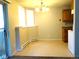 Dining room space next to the kitchen, featuring a chandelier and a sliding glass door at 17331 E Mansfield Ave # 311L, Aurora, CO 80013