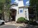 Two story condo building with wood balconies and stairs, trimmed with light siding at 17331 E Mansfield Ave # 311L, Aurora, CO 80013