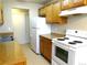 Functional kitchen featuring tile floor, modern appliances, and neutral countertops at 17331 E Mansfield Ave # 311L, Aurora, CO 80013