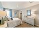 Cozy bedroom featuring large windows, neutral walls, and a decorative mirror for a relaxing retreat at 3193 Belleville Ridge Rd, Elizabeth, CO 80107