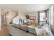Inviting living room with a comfortable gray sofa, stylish decor, and natural light from the window at 3193 Belleville Ridge Rd, Elizabeth, CO 80107