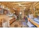 Spacious workshop featuring ample storage, workbenches, and pegboard, ideal for hobbies and projects at 10786 Marclif Rd, Conifer, CO 80433