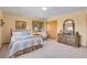 Comfortable bedroom with light yellow walls, wood trim, and a large closet at 10786 Marclif Rd, Conifer, CO 80433