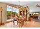 Dining room featuring mountain views, wood floors, and a statement light fixture at 10786 Marclif Rd, Conifer, CO 80433