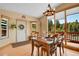 Dining room with wood floors, large windows, and a view of the forest at 10786 Marclif Rd, Conifer, CO 80433