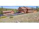 Charming home featuring a spacious detached garage on a large lot with a scenic mountain view at 10786 Marclif Rd, Conifer, CO 80433