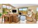 A sun-drenched living room with expansive windows, hardwood floors, and mountain views at 10786 Marclif Rd, Conifer, CO 80433