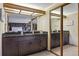 Elegant bathroom vanity with dual sinks, granite countertop, ample cabinet space, and a large mirror creating an open feel at 2783 W Long Dr # B, Littleton, CO 80120
