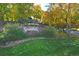 Sign for the South Park neighborhood with lush landscaping, flowers, and rock wall at 2783 W Long Dr # B, Littleton, CO 80120