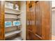 This well-stocked pantry features shelving and a door, offering ample storage for groceries at 2783 W Long Dr # B, Littleton, CO 80120