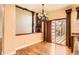 A dining room showing hardwood floors, sliding glass doors, and a fireplace at 9602 S Hackberry St, Highlands Ranch, CO 80129