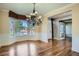 Elegant dining room with hardwood floors, chandelier, and bay window at 9602 S Hackberry St, Highlands Ranch, CO 80129