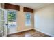 Bright office space with hardwood floors, crown molding, and large windows at 9602 S Hackberry St, Highlands Ranch, CO 80129