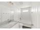 Bathroom featuring granite counters, subway tile in the shower, and neutral tones at 10152 Yampa Ct, Commerce City, CO 80022