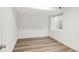 Bedroom featuring wood-look flooring, a bright window, and neutral paint at 10152 Yampa Ct, Commerce City, CO 80022