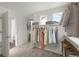 Walk-in closet featuring installed shelving, carpeted floors, and bright, natural light at 10152 Yampa Ct, Commerce City, CO 80022