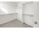 Walk-in closet featuring carpeted floors, shelving, and ample storage space at 10152 Yampa Ct, Commerce City, CO 80022