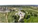 Overhead view of the park featuring play areas, basketball court, open fields, and walking paths at 5323 E Hamilton Ave, Castle Rock, CO 80104