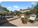 Inviting backyard featuring a fire pit, seating, and a well-maintained wooden deck, perfect for outdoor entertaining at 5323 E Hamilton Ave, Castle Rock, CO 80104