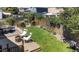 Landscaped backyard with a patio, lawn, lounge chairs, and fenced perimeter at 5323 E Hamilton Ave, Castle Rock, CO 80104