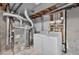 Unfinished basement features washer, dryer, and furnace at 5323 E Hamilton Ave, Castle Rock, CO 80104