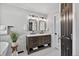 Bathroom features dual sinks, dark hardware, and stylish fixtures at 5323 E Hamilton Ave, Castle Rock, CO 80104
