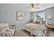 Cozy bedroom with a ceiling fan, large window, and decorative wall art at 5323 E Hamilton Ave, Castle Rock, CO 80104