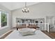 Open dining room with high ceilings, stylish lighting, and a view into the living room at 5323 E Hamilton Ave, Castle Rock, CO 80104