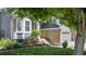 Inviting home exterior with manicured lawn, flower beds, and charming stone accents at 5323 E Hamilton Ave, Castle Rock, CO 80104