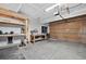 Spacious garage with built in workshop, shelving, and tool storage space with access to garage door at 5323 E Hamilton Ave, Castle Rock, CO 80104