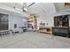 Organized garage with workbench, shelving, tool storage, and access door, providing ample space for projects and parking at 5323 E Hamilton Ave, Castle Rock, CO 80104